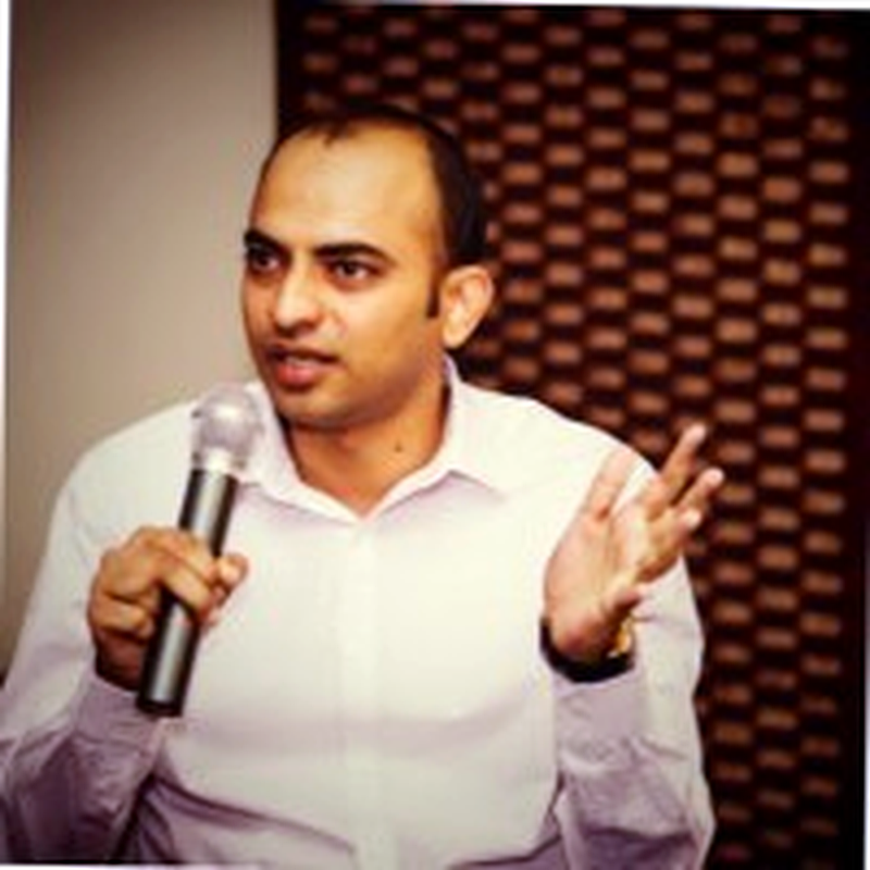 Qasim Jamil speaking at an event